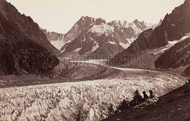 Walkers resting beside a glacier  French Alps  c 1870s.