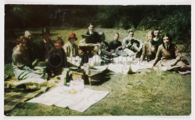A group of people having a picnic.
