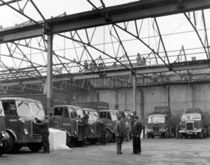 Preparing lorries for the day's work  1956.
