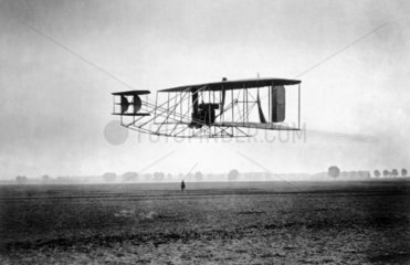 A Wright biplane in flight  c 1905.