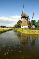 Windmills by a canal  Netherlands  2007.