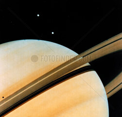 Saturn and two of its moons  Tethys and Dione  1980.