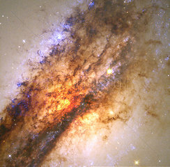 A galaxy dissapearing into a black hole  c 2000.