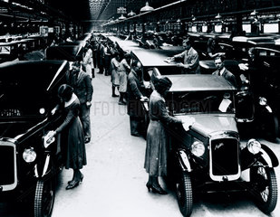 Polishing finished motor cars at the Austin motor car factory  27 May 1935.