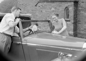 Couple washing a car  1949.