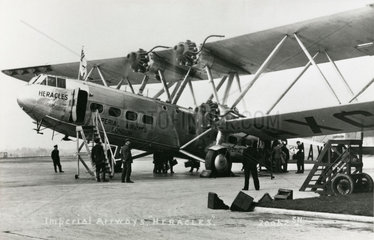 HP42 G-AAXC 'Heracles' boarding passengers  postcard  1931-1941.
