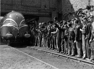 Steam locomotive 'Coronation' being cheered by workers  25 May 1937.