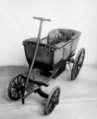 Four-wheeled child's carriage  c 1845.