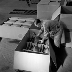 Man packs box of Cathode ray tubes  Mullard Ltd  Simonstone 1956.