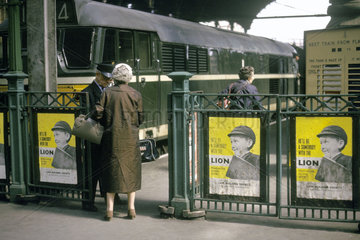 Passengers passing through ticket barrier  Liverpool Street station  1963.