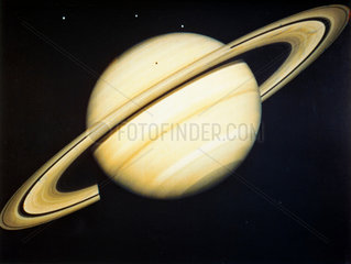 The planet Saturn and three of its moons  1981.