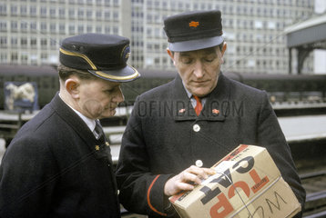 Station Inspector and porter wearing new British Rail uniform  Waterloo  1966.