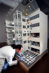 Cleaning a model of the Chelsea and Westminster Hospital  1998.