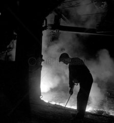 Worker in blast furnace  Workington  1952.