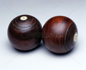 Two wooden antique lawn bowls  19th century.