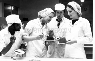 Students eating Christmas pudding  c 1971.