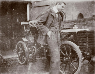 C S Rolls standing beside his 24 hp Panhard  1902.