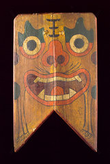 Wooden shield painted with a demon’s face  Chinese  19th century.