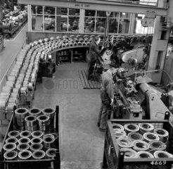Men working on rows of small stators  English Electric  Bradford  1956.