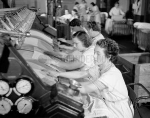 Industrial ironing  1952. These women are