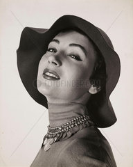 'Woman in hat with necklace'  c 1960.