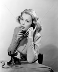 Women answering the telephone  c 1948.