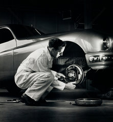 Ferodo worker fits brake shoe to Jaguar car  Chapel en le Firth  1959.