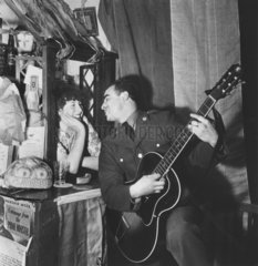 Soldier playing the guitar  Second World War  30 November 1942.