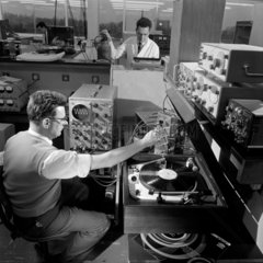 An engineer makes audio measurements in the laboratory  1966.