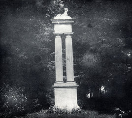 Statue on pillar in garden  Lacock Abbey   Wiltshire  1840.