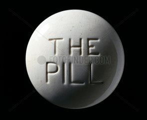 Ceramic paperweight of the contraceptive pill  c 1970.