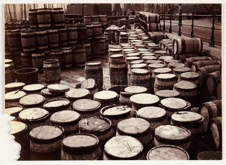 Barrels on a harbour-side  Whitby  c 1905.