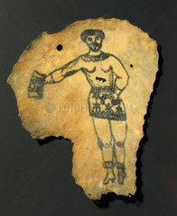 Human skin  tattooed with male figure in skirt  probably French  19th century.