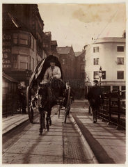A man driving a horse and cart  Whitby  North Yorkshire  c 1905.