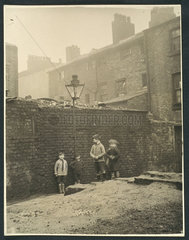 Boys playing in a Manchester slum housing area  c 1935.