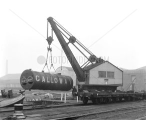 Crane with a heavy load at Poplar Dock  London  c 1900.