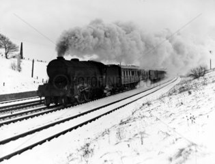 LNER down express  passes through the snowy
