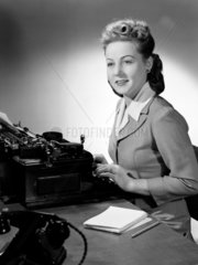 Woman typing  c 1948.