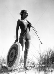 Woman wearing a bathing costume standing on