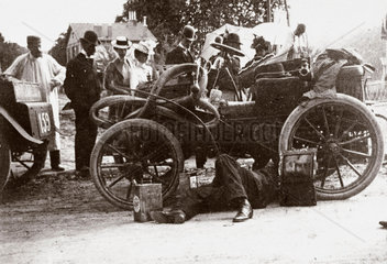 C S Rolls adjusting clutch prior to start of Paris-Boulogne Race  1899.