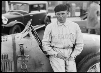 Achille Varzi beside a Bugatti Type 51 racing car  Germany  c 1931.