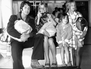 Paul McCartney with wife and children  London Airport  September 1974.