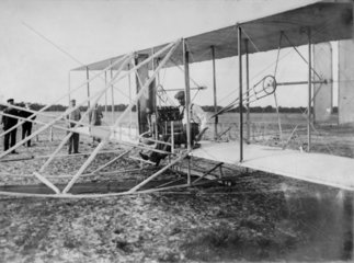 Wilbur Wright on his aeroplane at Hunaudieres  France  August 1908.