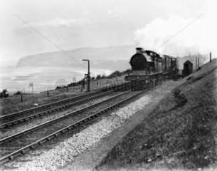 Mail train picking up a mail pouch at Colwyn Bay  1909.