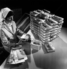 Female worker packing aluminium food trays at Alcan factory  1970.