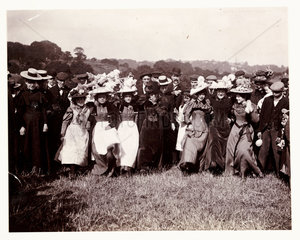 Line of dancing women  c 1898.