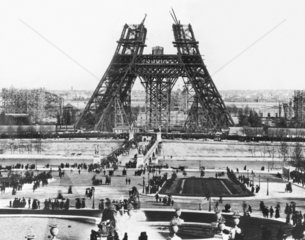 The Eiffel Tower under construction for the