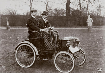 C S Rolls (left) and passenger in a Peugeot Voiturette motor car  c 1900.