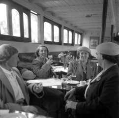 Women enjoying a glass of beer in the saloon of a river steamer  London  1950.