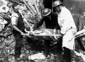 Rescuing a dog after an air raid  Second World War  October 1940.
